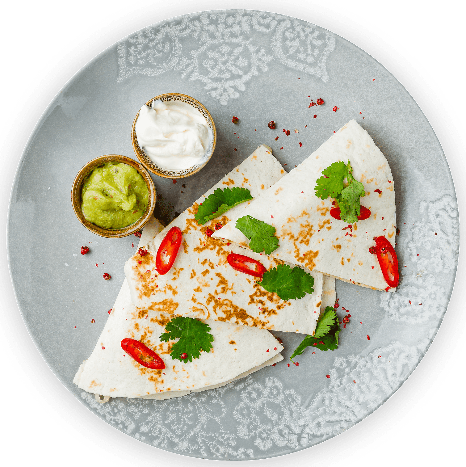 GettyImages-1331176627 1 Tortillas with chili, guacamole, and sour cream.