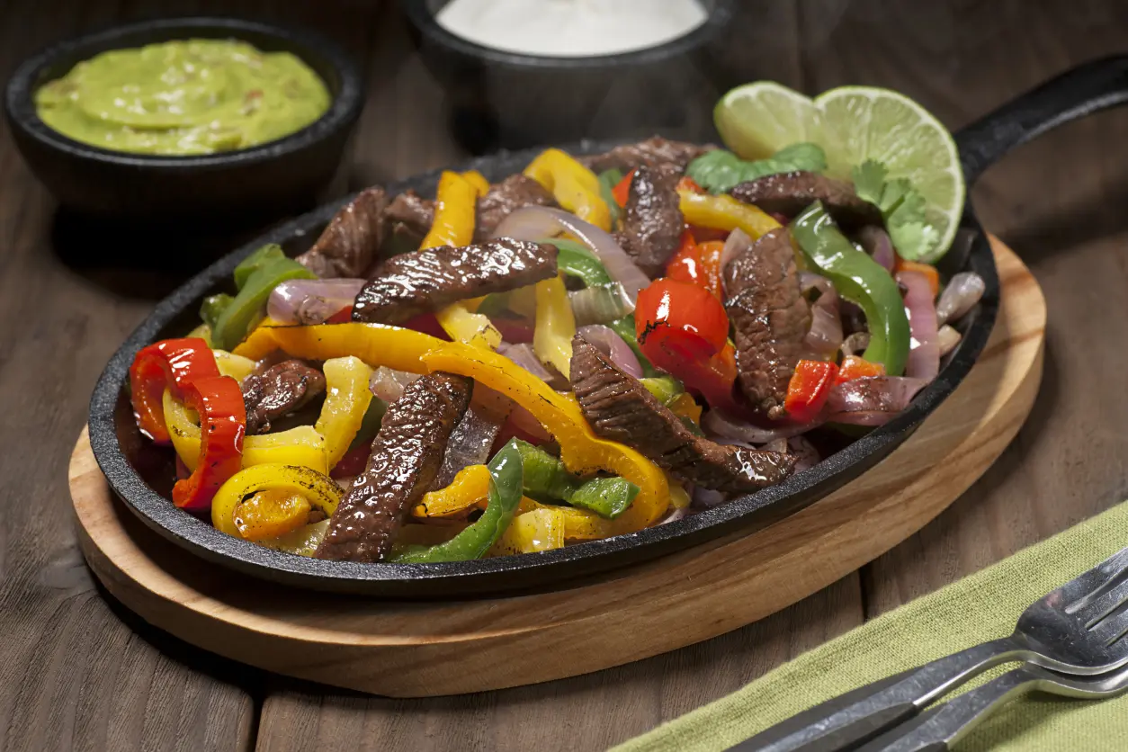 New Project Sizzling fajitas with colorful bell peppers.