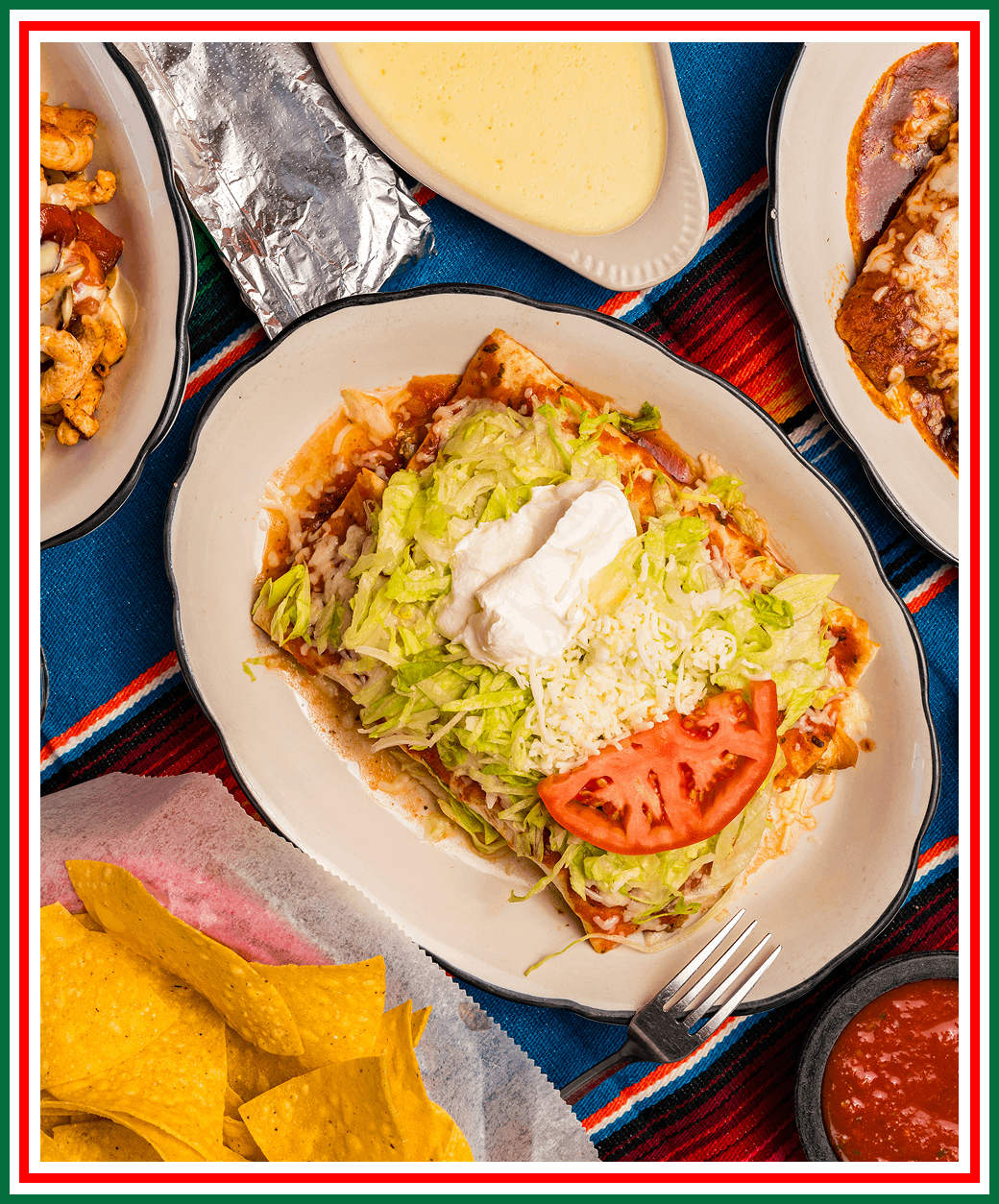 Group 42 Mexican dish with toppings and tortilla chips.